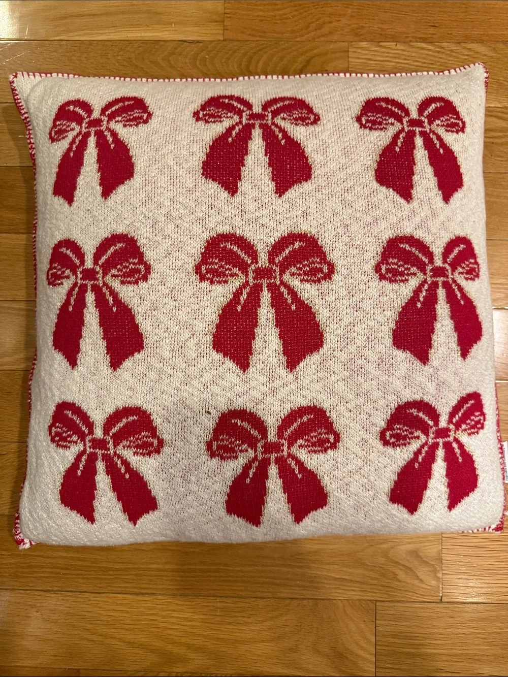 cupcakes & cashmere Red Bow Pattern Knit Holiday Pillow